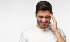 man with migraine